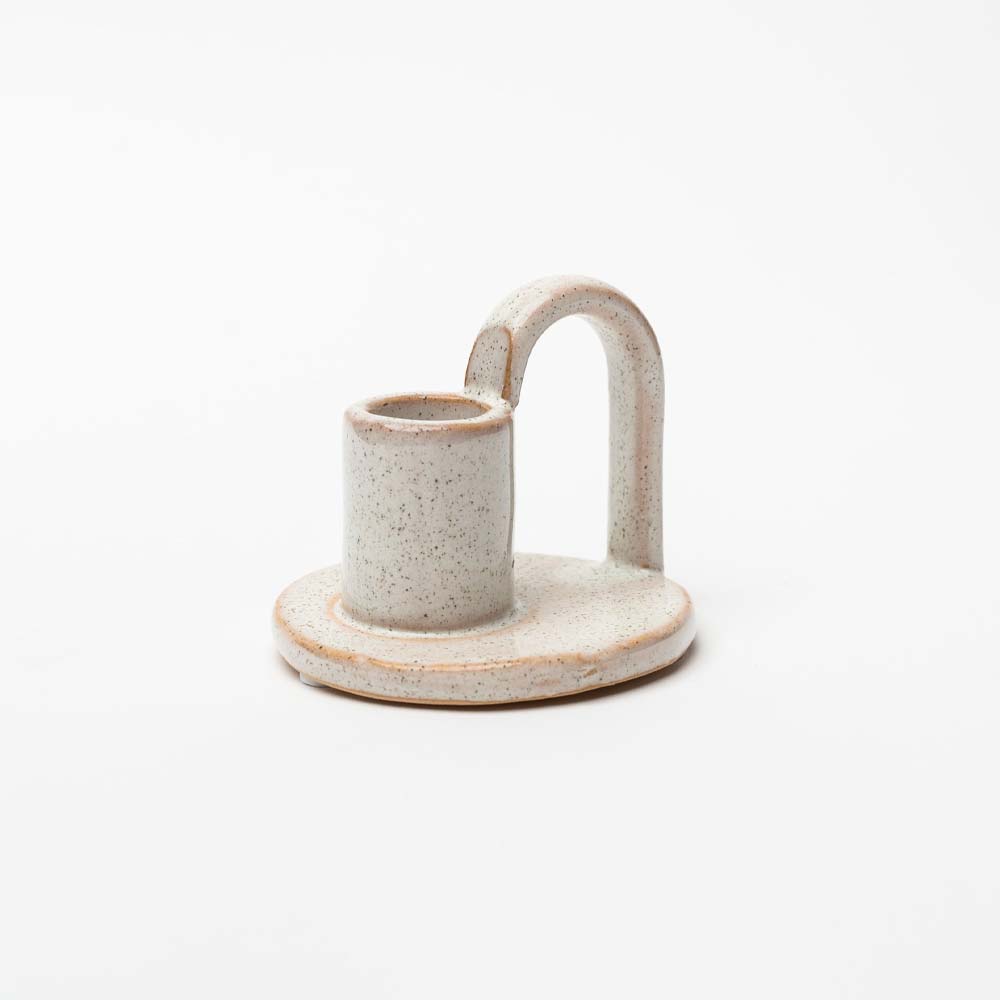 Ivory glazed Stoneware Candle Holder with finger loop on a white background