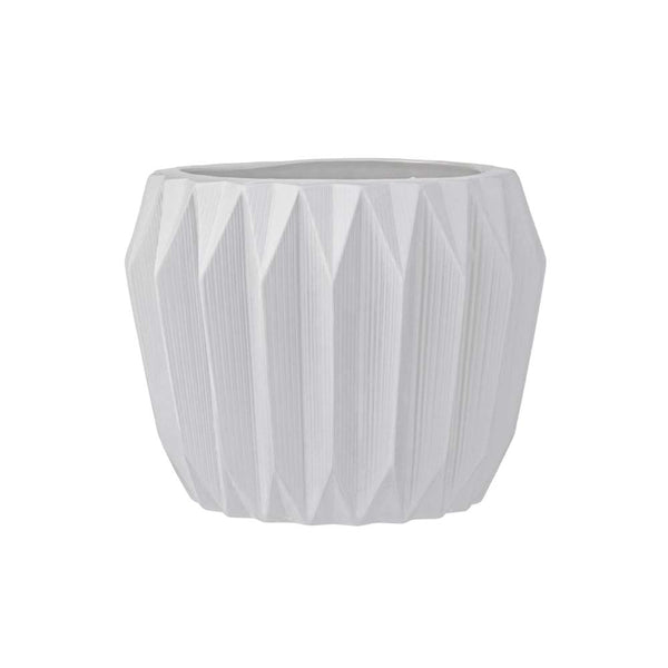 White stoneware planter with fluted sides on a white background