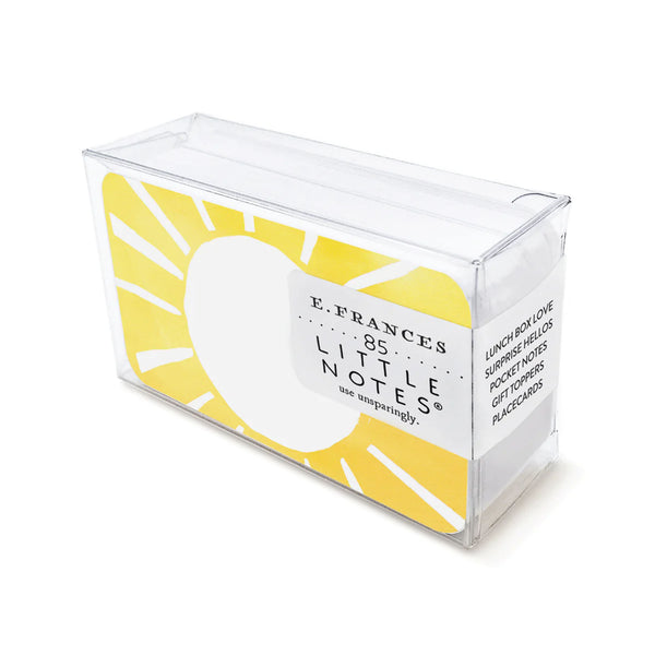 E francés brand little note cards with yellow sun in clear box on a white background
