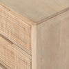 Six drawer 'Sydney' dresser with cane drawer fronts and mango wood pulls with natural mango wood exterior by Four Hands Furniture on a white background