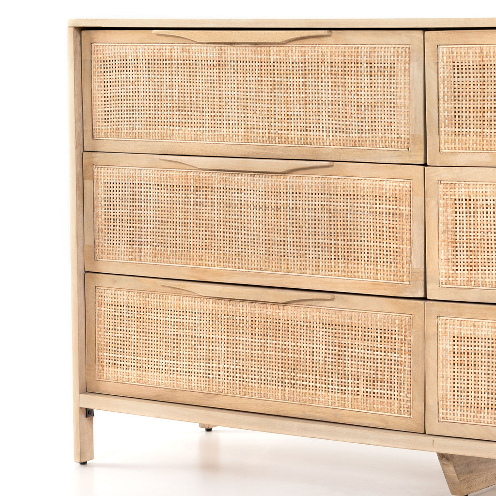 Six drawer 'Sydney' dresser with cane drawer fronts and mango wood pulls with natural mango wood exterior by Four Hands Furniture on a white background