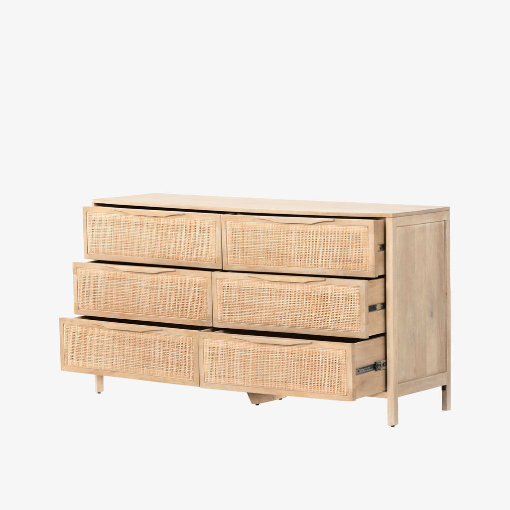Six drawer 'Sydney' dresser with cane drawer fronts and mango wood pulls with natural mango wood exterior by Four Hands Furniture on a white background