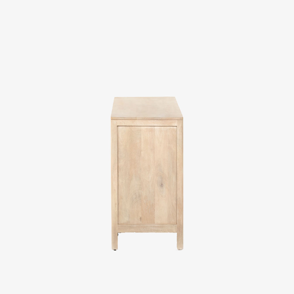 Six drawer 'Sydney' dresser with cane drawer fronts and mango wood pulls with natural mango wood exterior by Four Hands Furniture on a white background