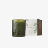 Thymes Frasier Fir candle in dark green vessel beside box on a white background