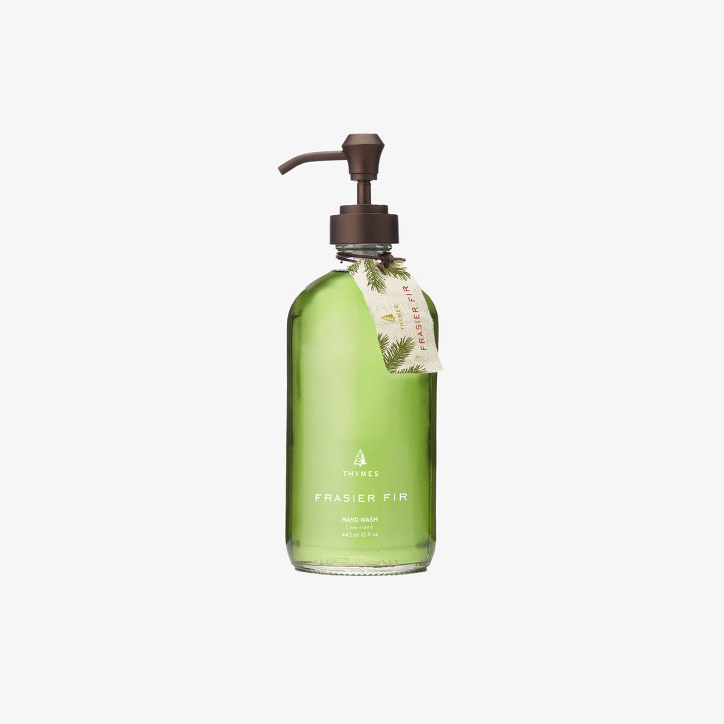 Green bottle of Thymes Frasier fir hand wash on a white background
