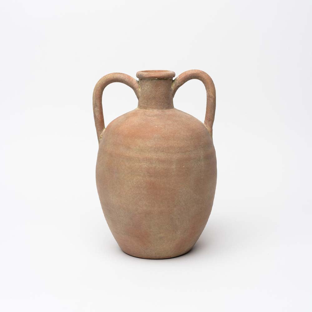 Terracotta urn with two handles on a white background