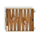 Backgammon set open with beige and white on a white background