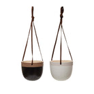 White and black terracotta hanging planters on a white background