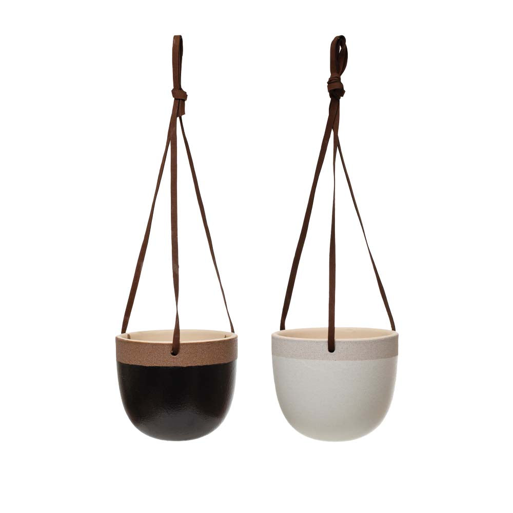 White and black terracotta hanging planters on a white background