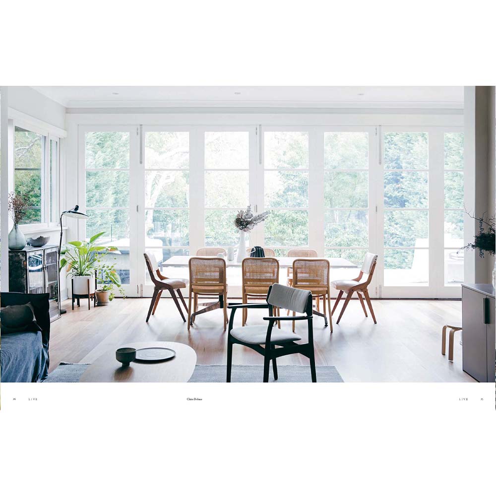 Photograph of dining room with light filled windows and cane backed chairs from book 'This is Home:The Art of Simple Living'