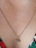 Scream Pretty brand gold tiger charm necklace on model