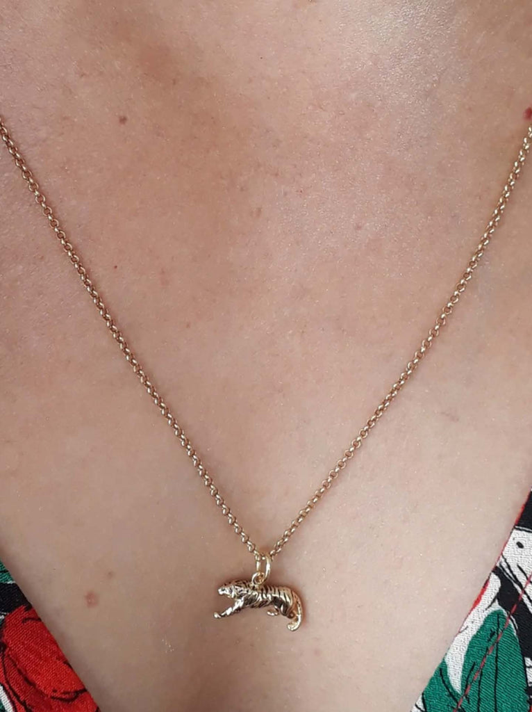 Scream Pretty brand gold tiger charm necklace on model