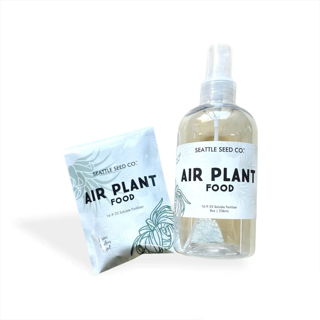 Bottle of air plant food from seattle seed company on a white background