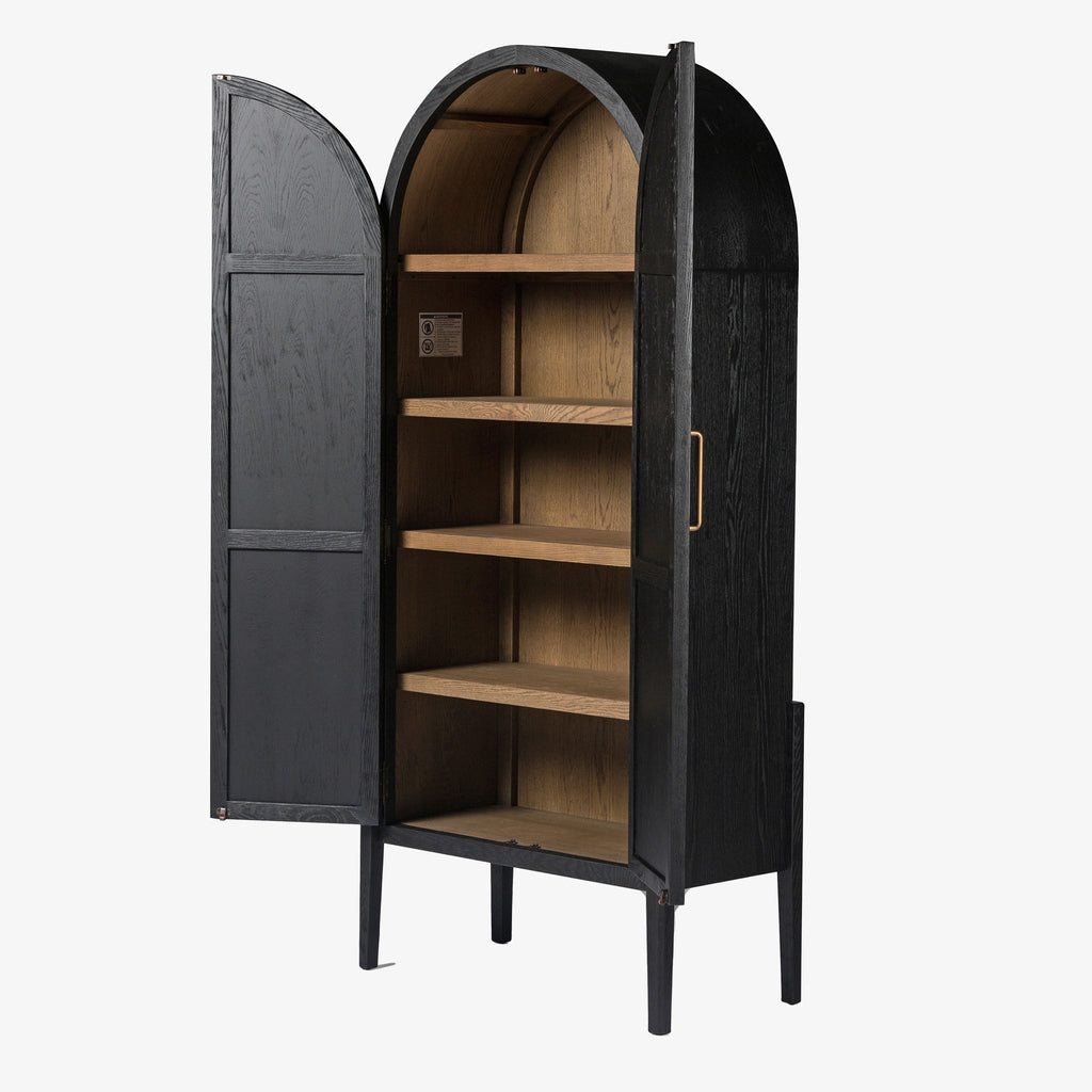 Four hands furniture brand Tolle black cabinet with arched top and black wood stained interior on a white background  Edit alt text