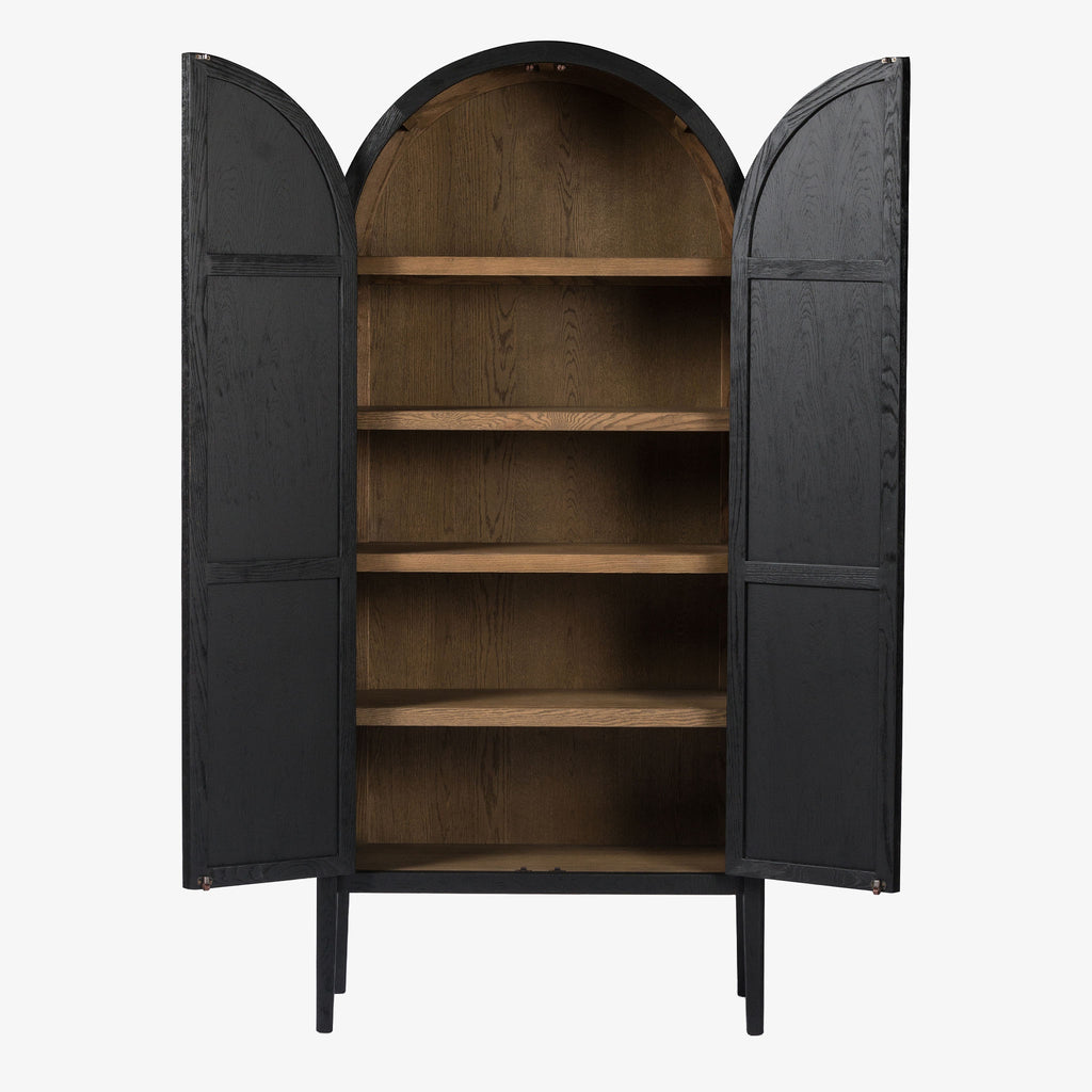 Four hands furniture brand Tolle black cabinet with arched top and black wood stained interior on a white background  Edit alt text
