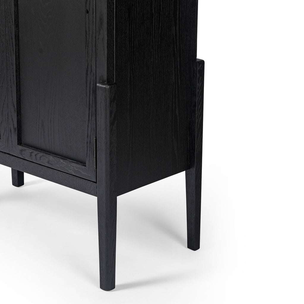 Four hands furniture brand Tolle panel door black cabinet with arched top and wood stained interior on a white background 