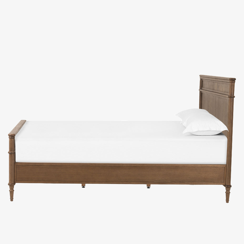 Wood 'Toulouse' bed with panels and spindle legs by Four hands furniture on a white background