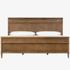 Wood 'Toulouse' bed with panels and spindle legs by Four hands furniture on a white background