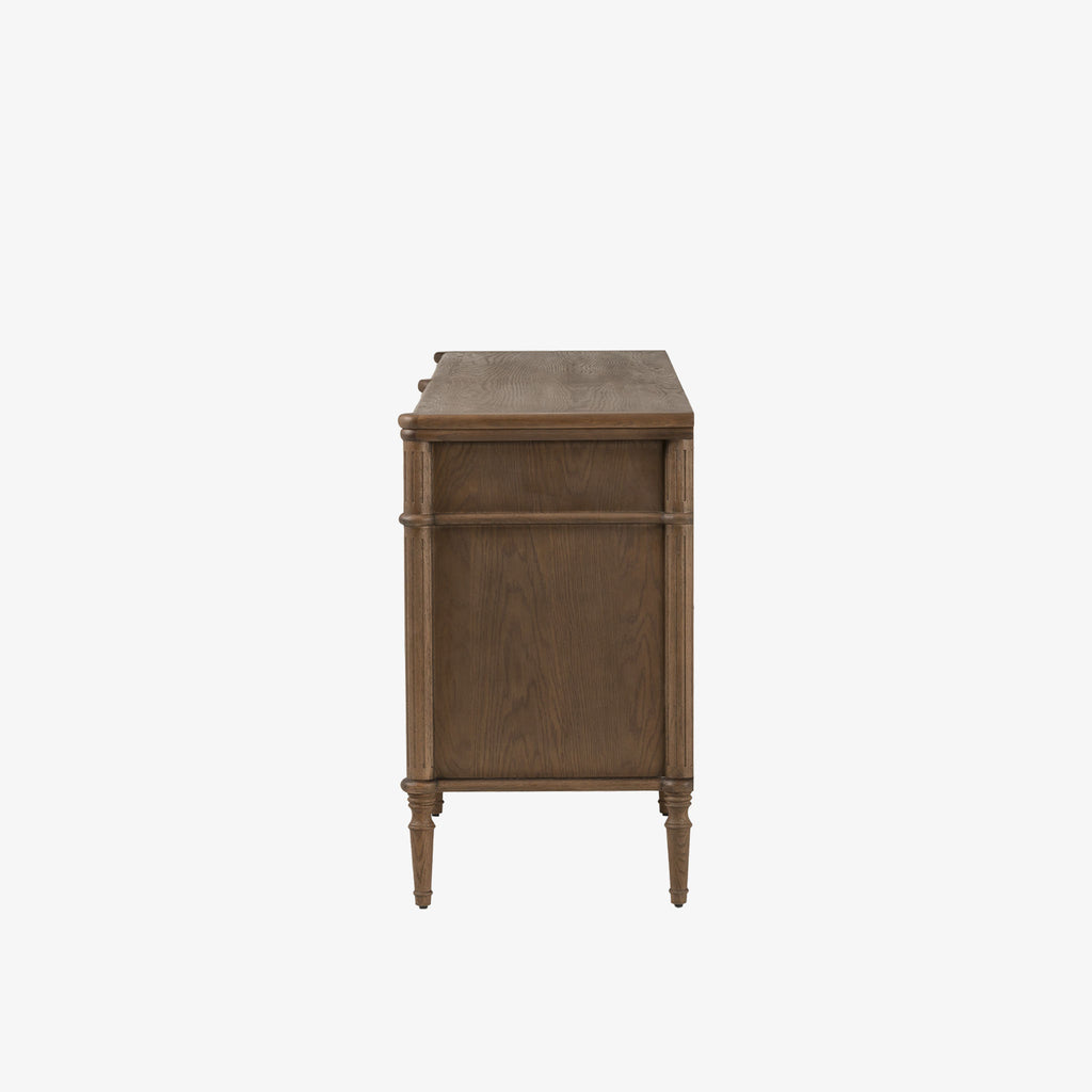 Oak six drawer 'Toulouse' dresser by four hands furniture on a white background