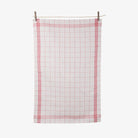 Red plaid Tissage de L’Ouest tea towel on a white background