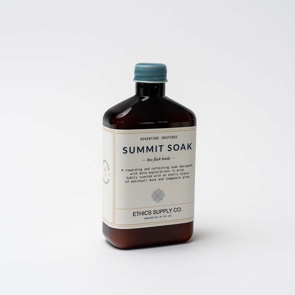 Brown bottle of Summit soak bath salts by ethics supply co on a white background