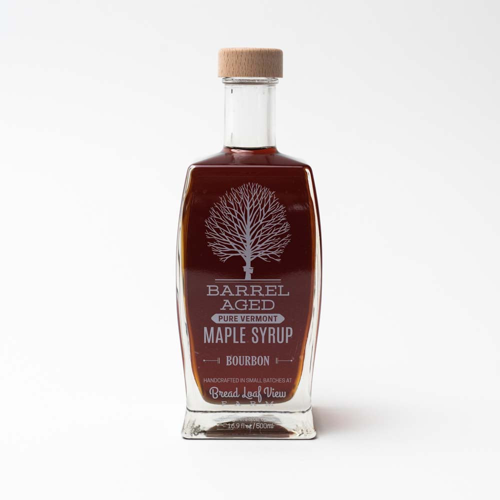 Glass bourbon maple syrup on a white background