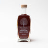 Glass bourbon maple syrup on a white background
