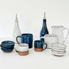 Collection of white and indigo hand made in Vermont pottery 