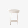 White round 'van' side table with shelf and drawer  by four hands furniture on a white background