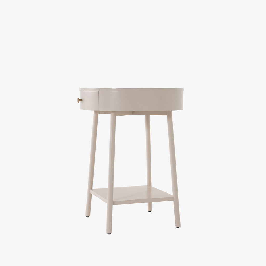 White round 'van' side table with shelf and drawer  by four hands furniture on a white background