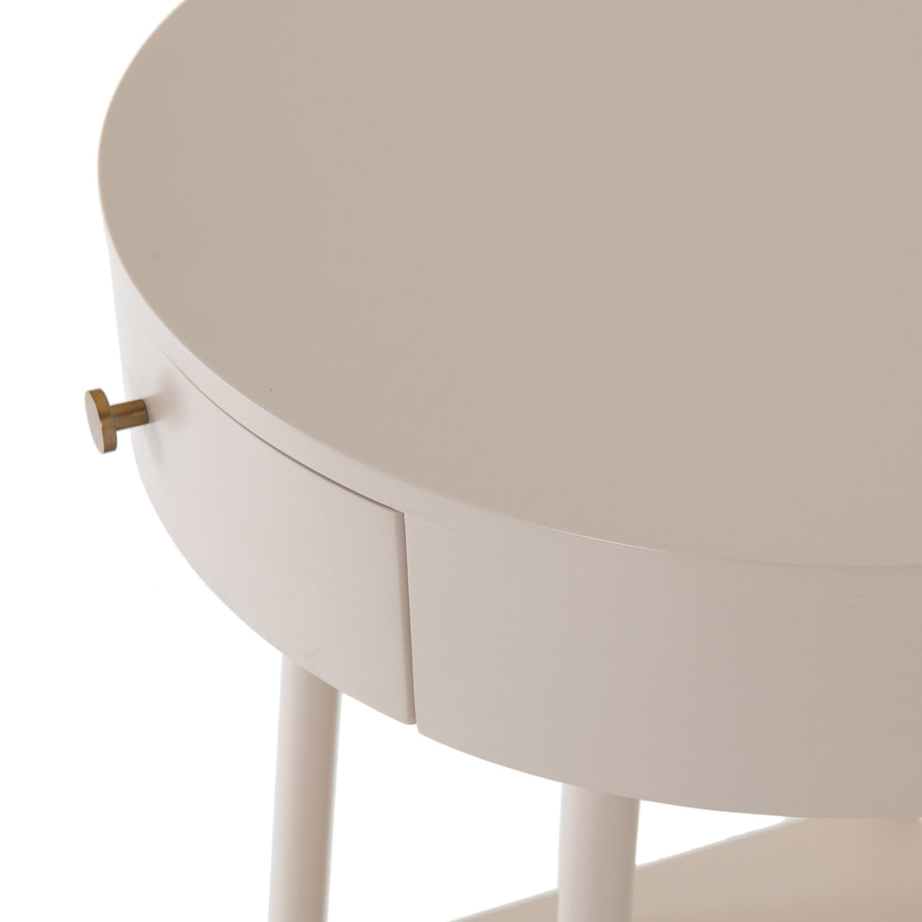 White round 'van' side table with shelf and drawer  by four hands furniture on a white background