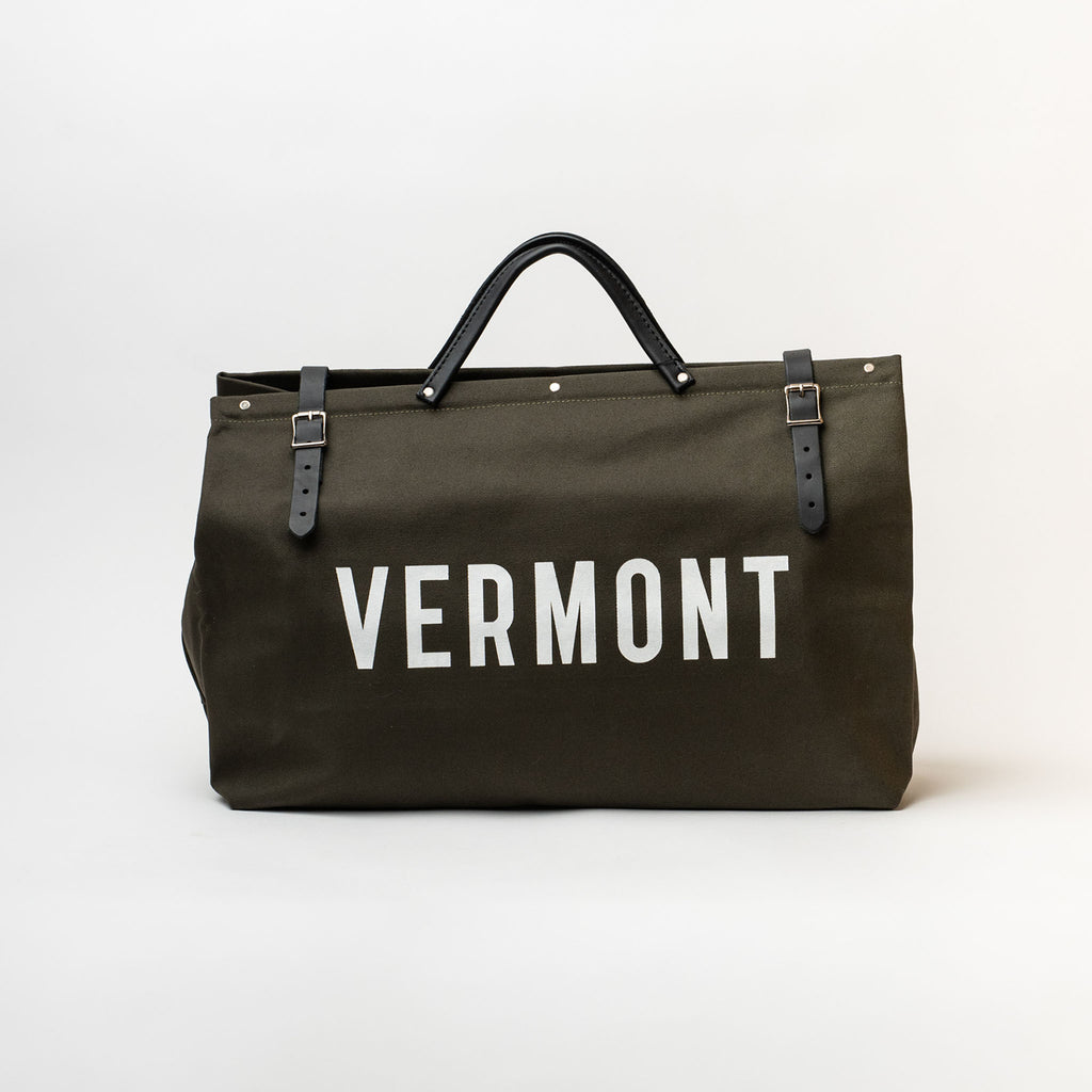 Olive green canvas carpet bag with Vermont printed on front in white letters