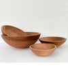 Four cherry salad bowls displayed on a white background