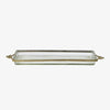 Glass tray with metal brass scallop edging and decorative metal bows on ends on a white background