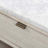 Close up of surface and hardware on Whitewashed nightstand with drawer and marble top on a white background