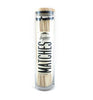 Black tip fireplace matches in glass container with wood top on white background