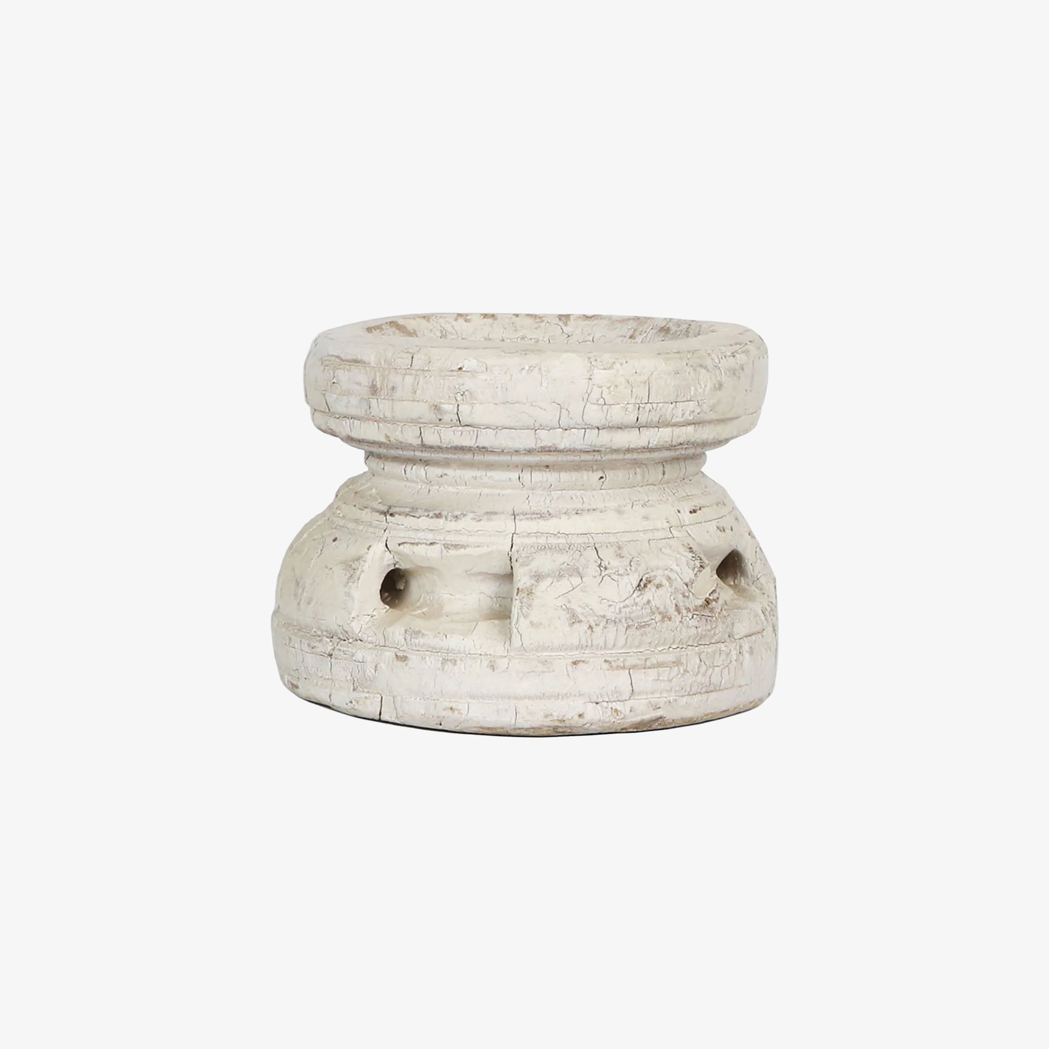 Vintage white seed spreader on a white background