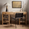 Wood desk with lamp and vase and Four hands brand wharton chair with black iron frame and black leather seat