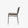 Side view of Four hands brand wharton chair with black iron frame and dark brown leather seat on a white background