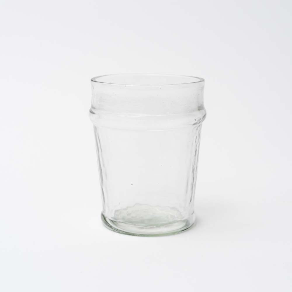 Hand blown juice glass on a white background