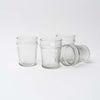 Four hand blown drink glasses on a white background