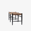 'Wyatt' Bench with leather strapped seat and black legs by four hands furniture on a white background