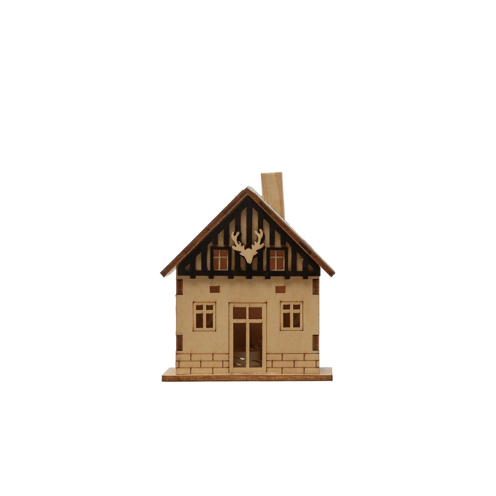 Laser cut LED light up wood cabin on a white background