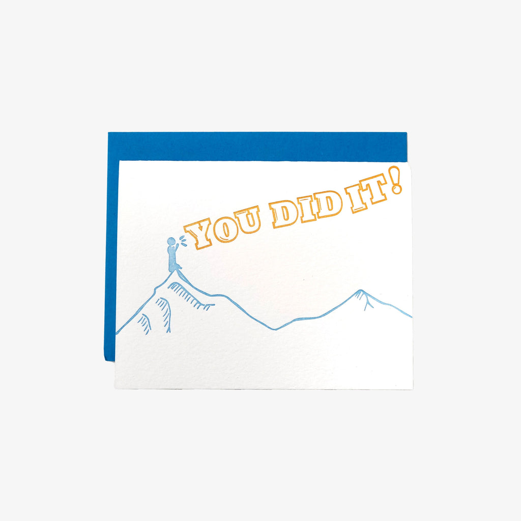 Letter press greeting card with blue mountain outline and words 'you did it' 