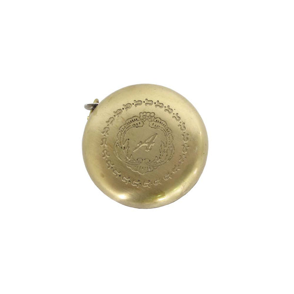 Small brass measuring tape with engraving on surface